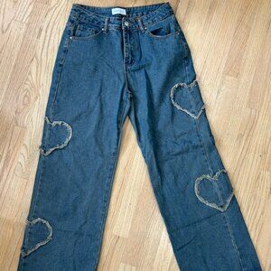 Dark-wash  wide leg jeans with heart detail.